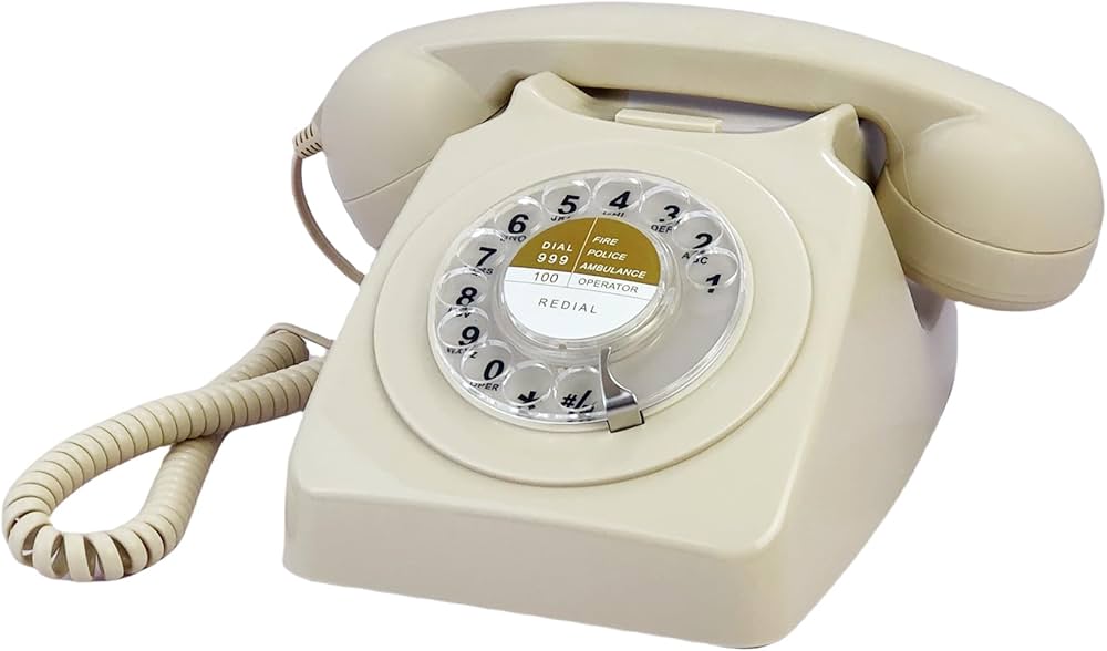 an old fashioned corded rotary telephone, with a coiled cord on the handset.