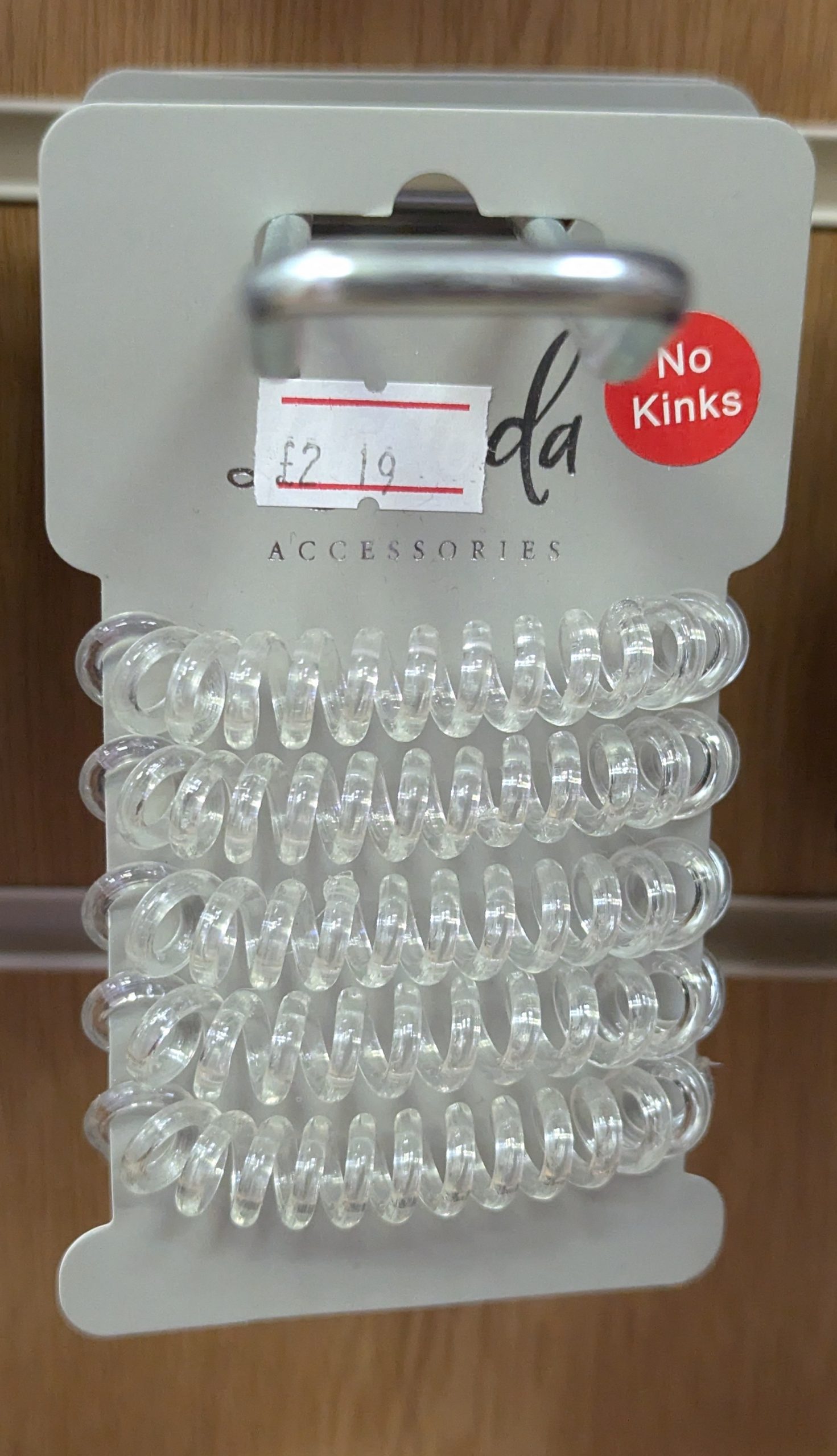 hair ties made of coiled clear plastic.